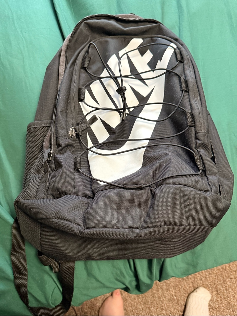 Nike Black Backpack with White Graphic and Elastic Bungee Cord